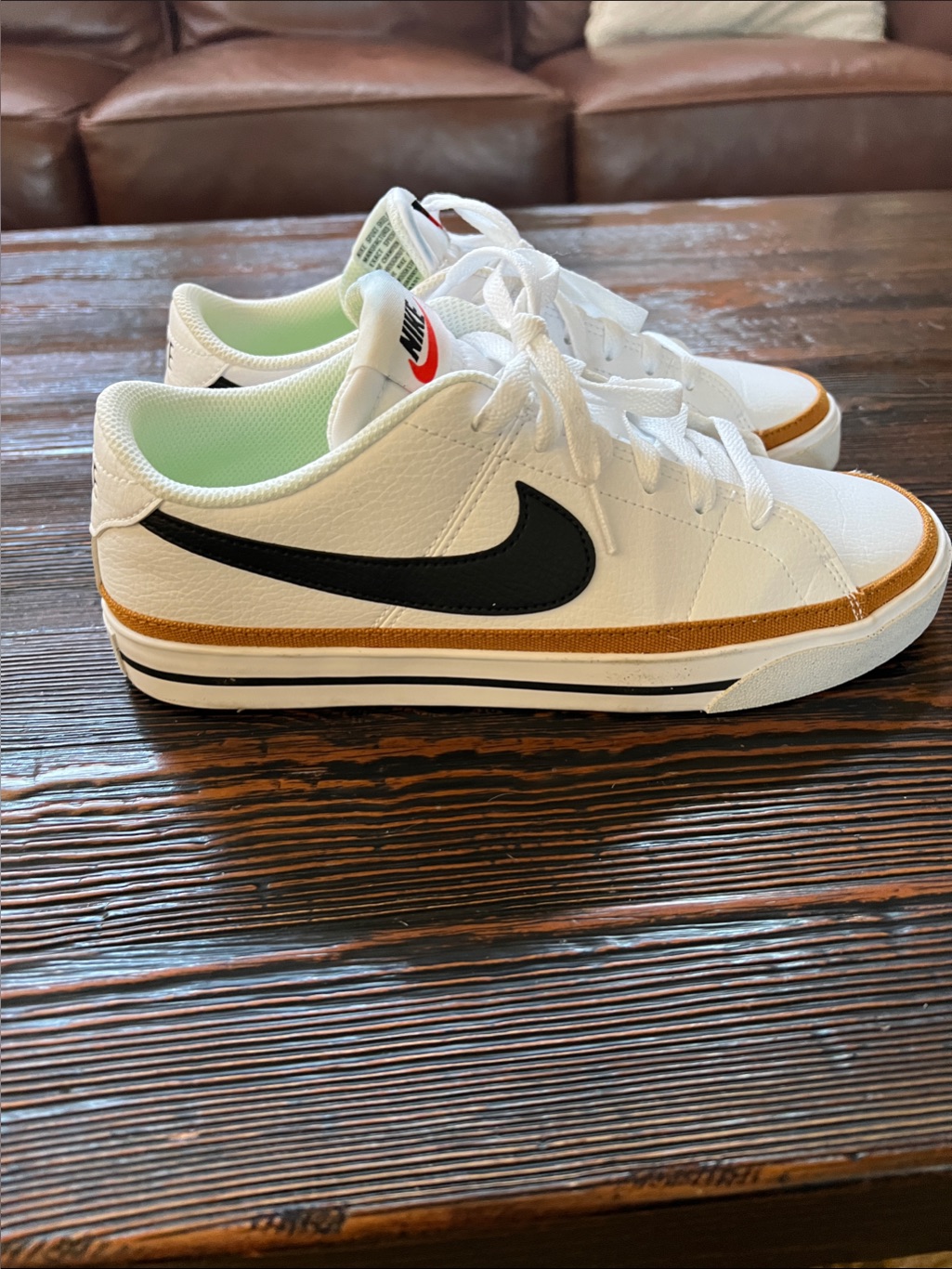Nike Women White Sneakers With Black Swoosh And Tan Accent